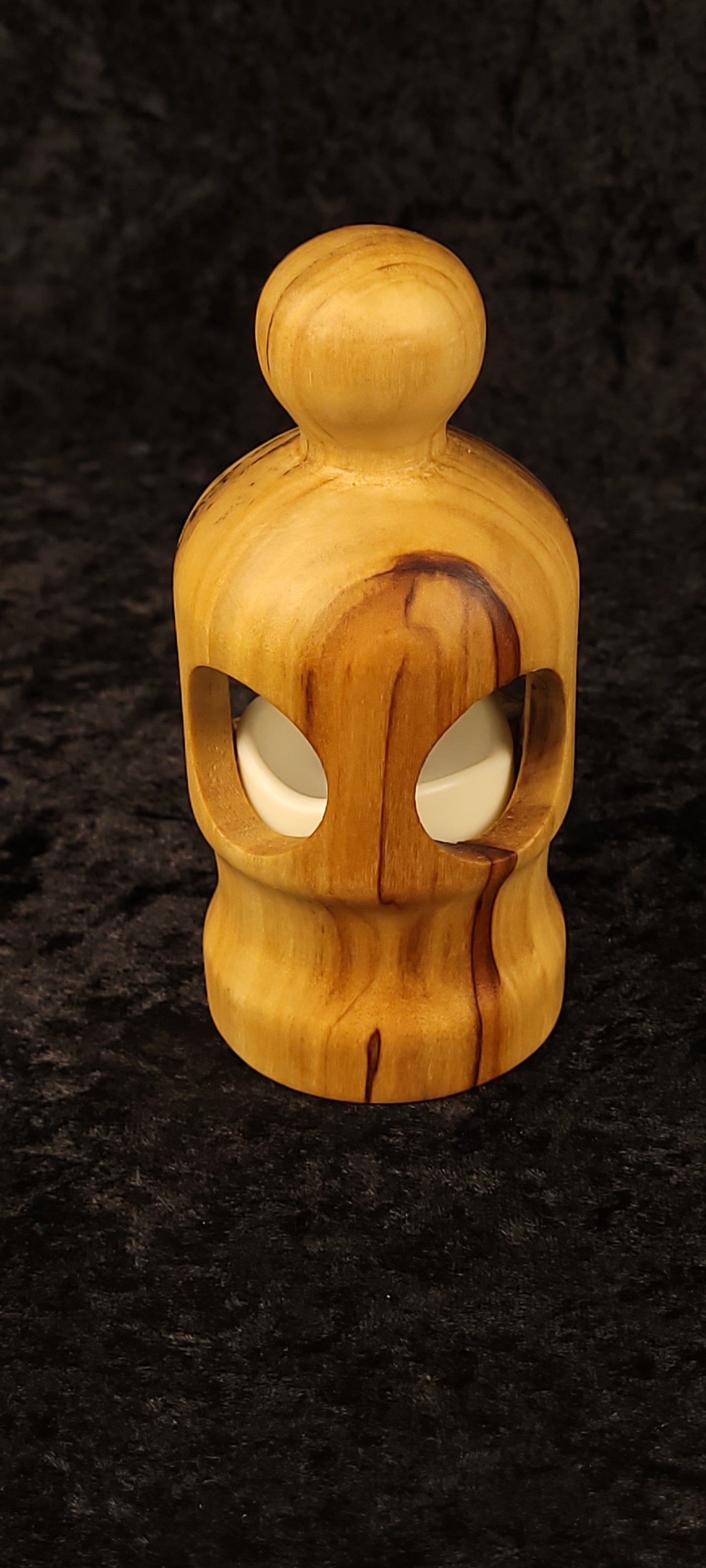Cottonwood figurative lantern glowing with LED candle - front view