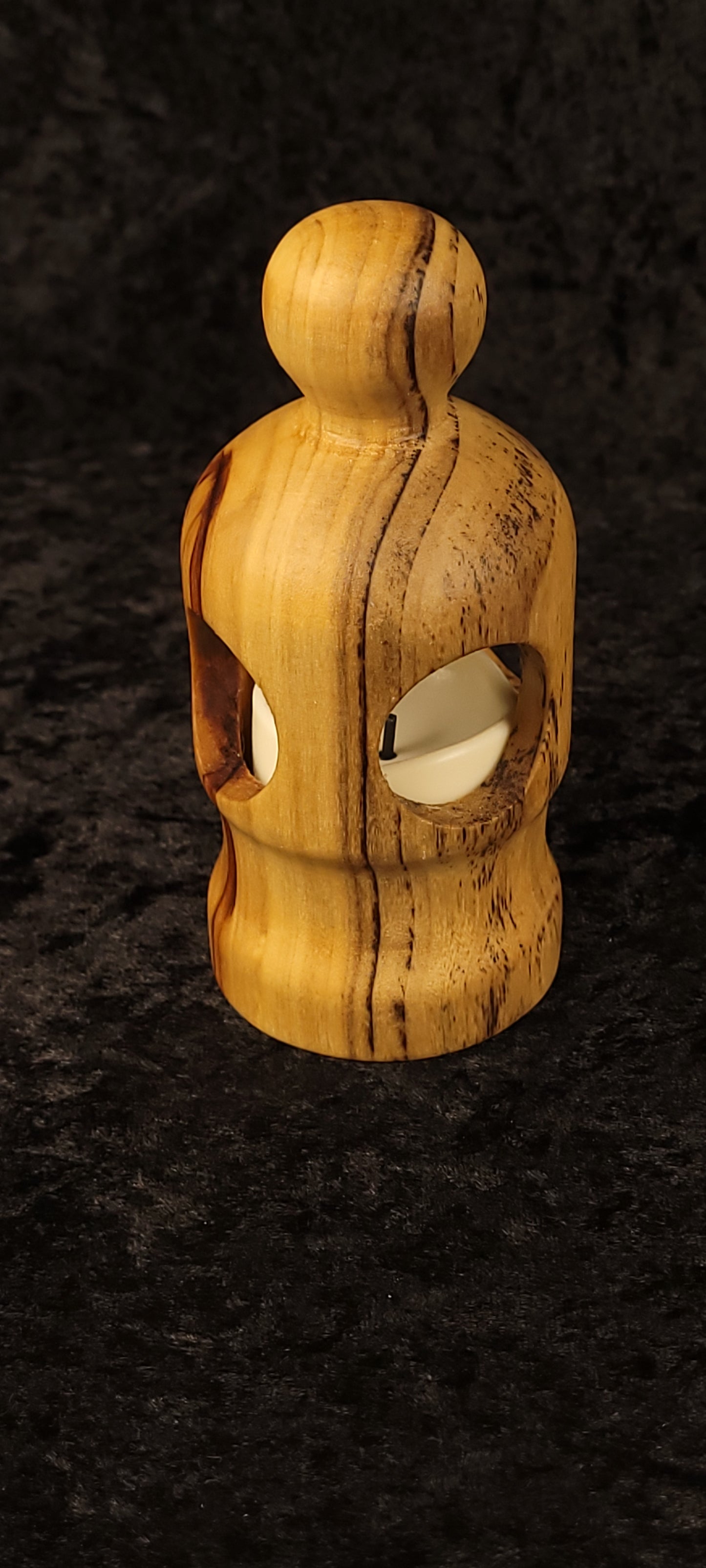 Cottonwood figurative lantern showing dual oval openings with LED glow - side view