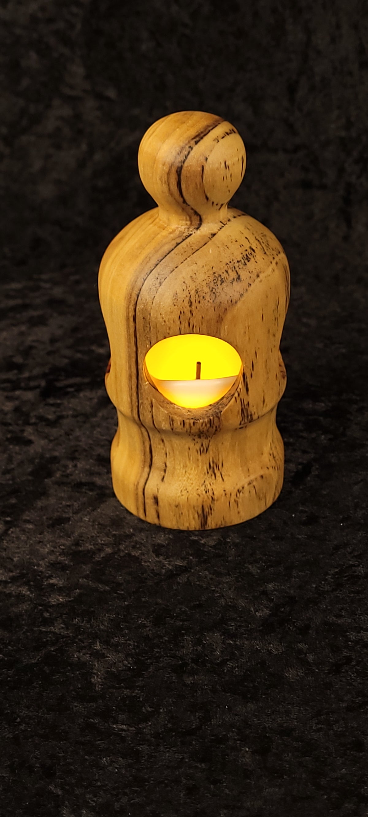 Cottonwood figurative lantern glowing from behind - warm amber light