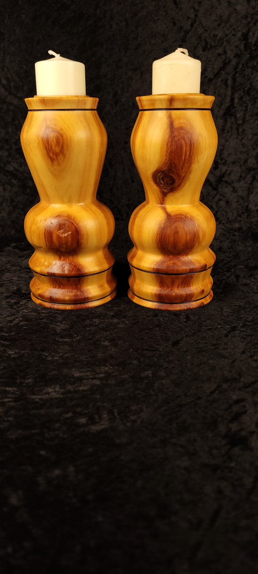 Matched pair of hand-turned aspen candle holders with pillar candles - front view