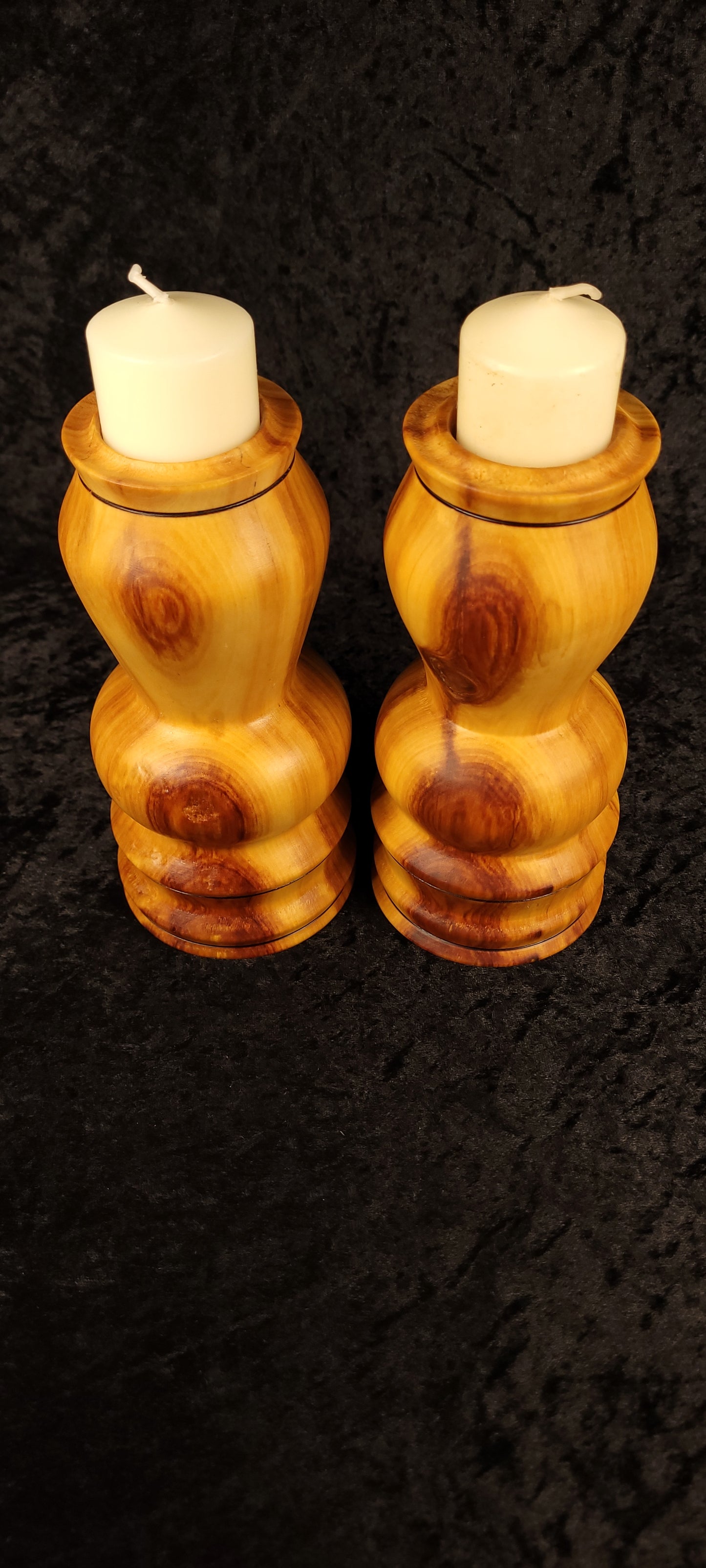 Aspen candle holders tipped showing hollow interior and included pillar candles