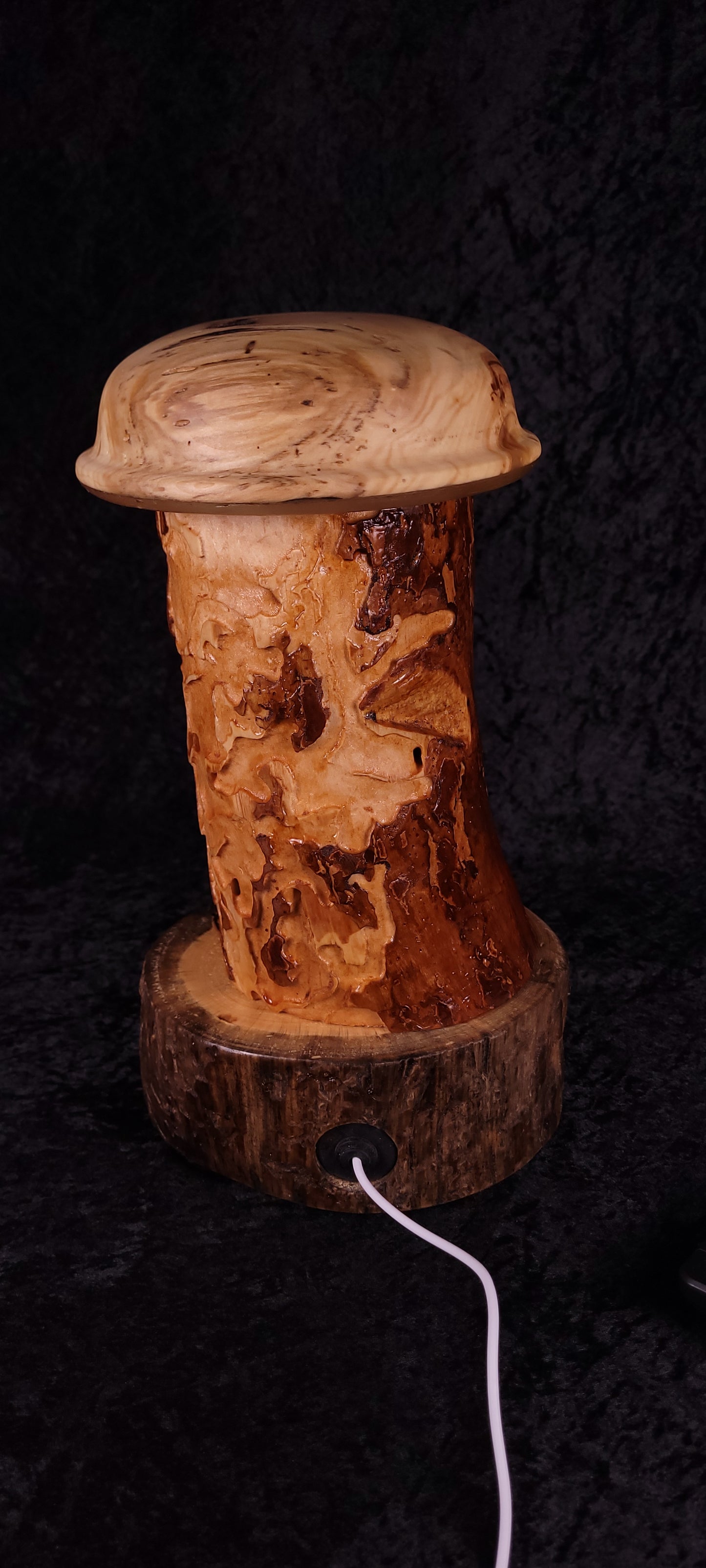Handcrafted Wormy Pine RGB Lamp lit with warm red glow, full height view