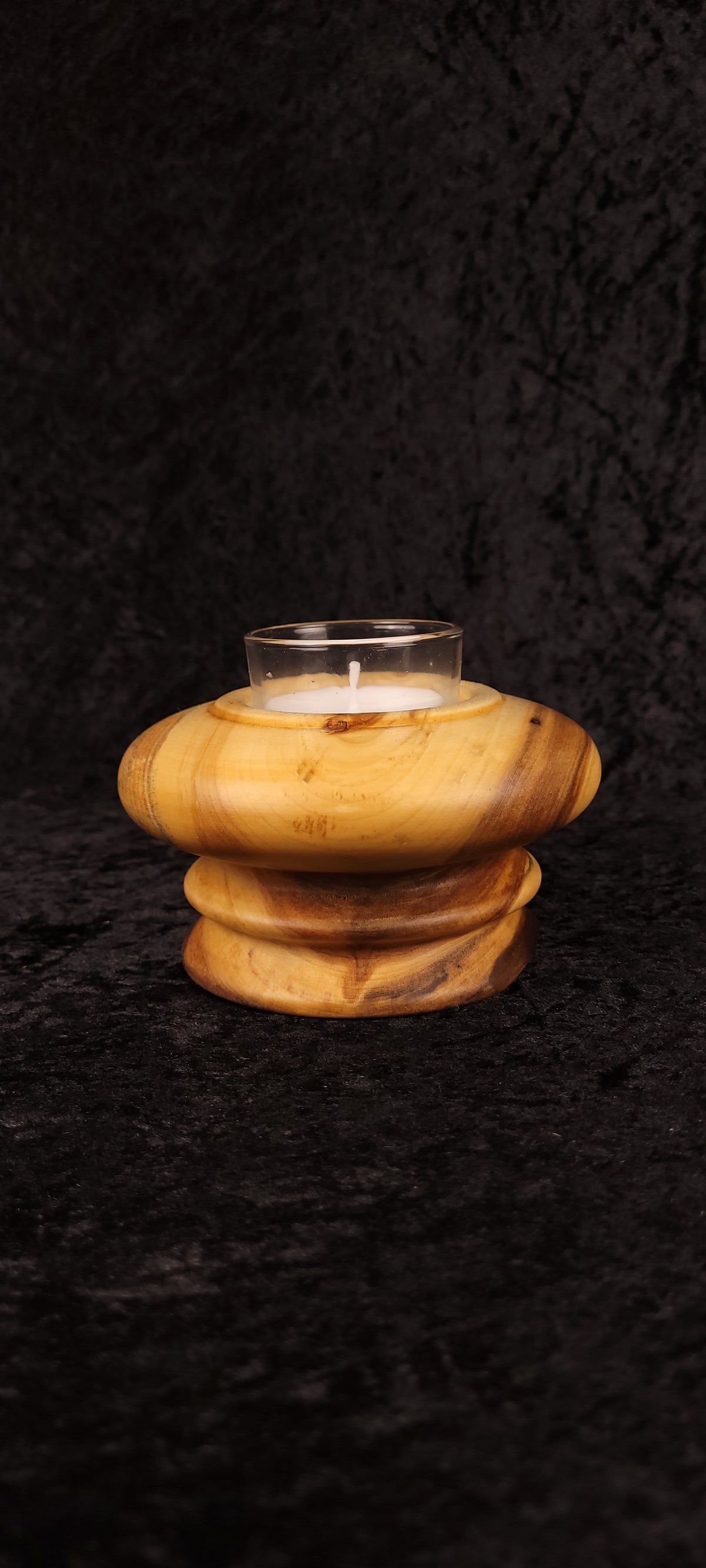 Side view of handcrafted Aspen wood candle holder with glass votive insert