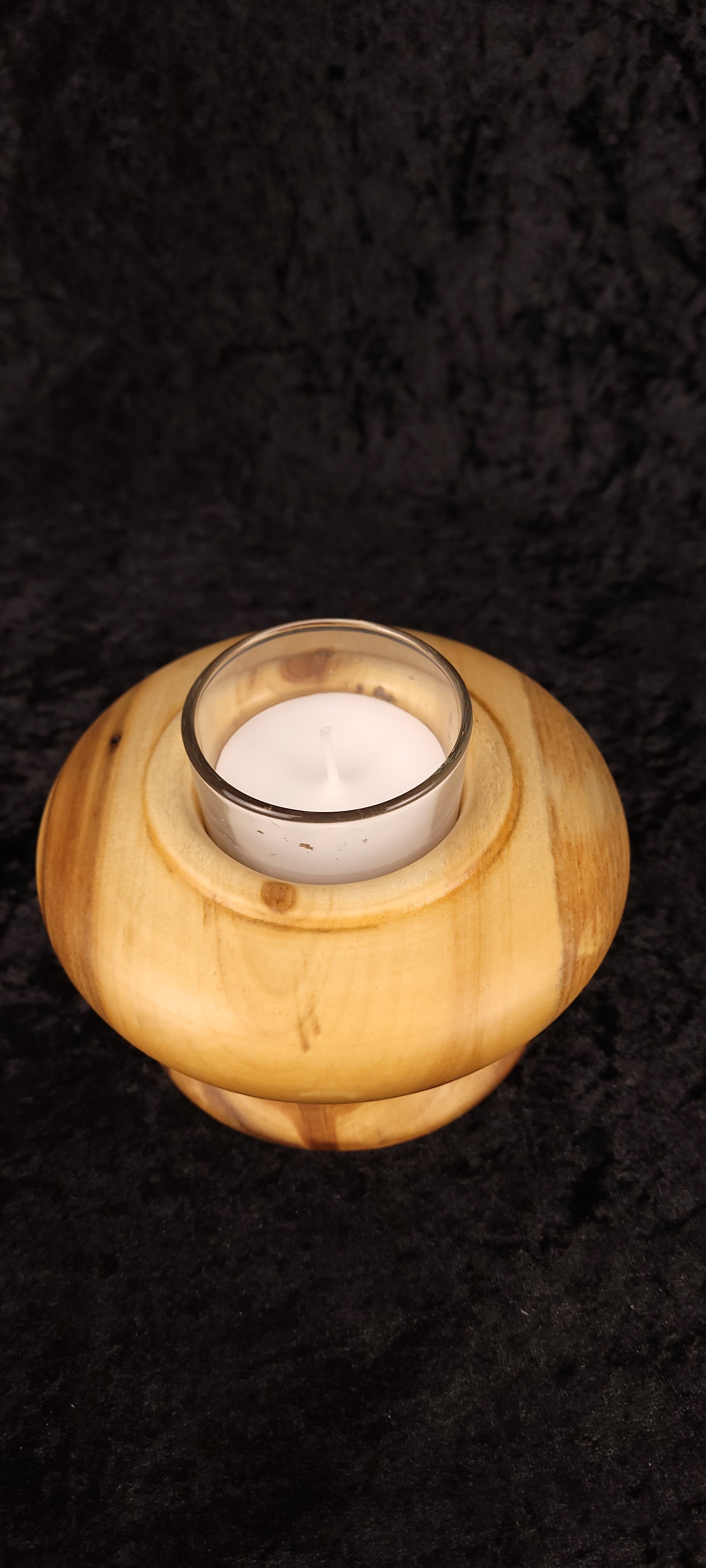 Top view of handcrafted Aspen wood candle holder and glass votive insert