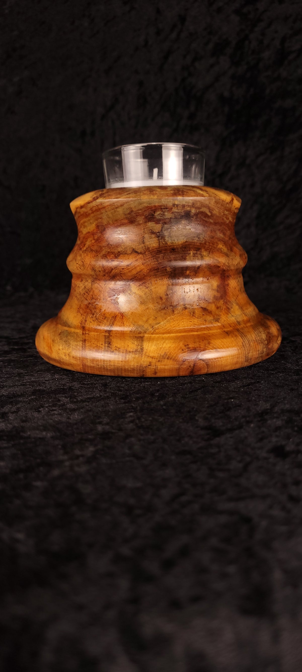Handcrafted Aspen Candle Holder No. 5 with lit candle, angled view