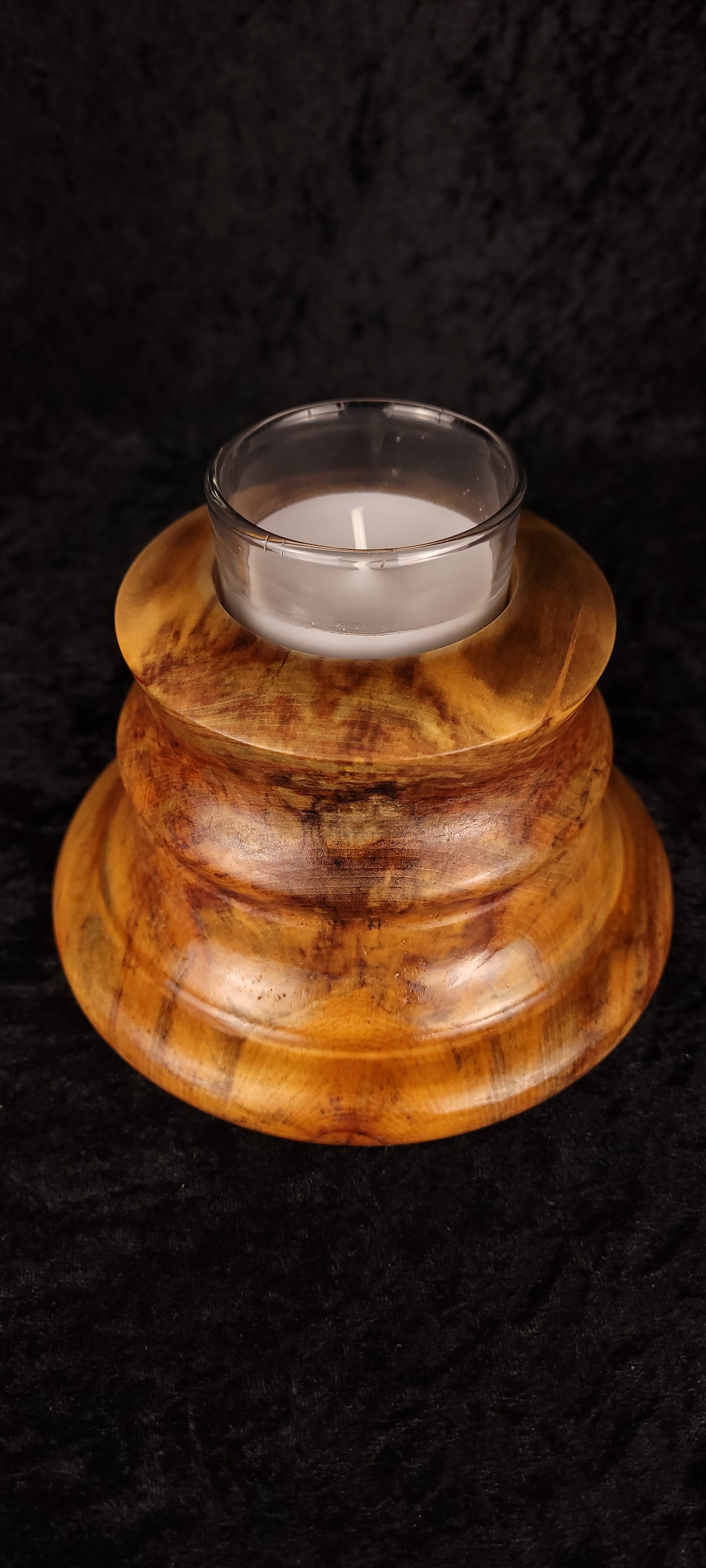 Handcrafted Aspen Candle Holder No. 5 with lit candle, overhead angled view